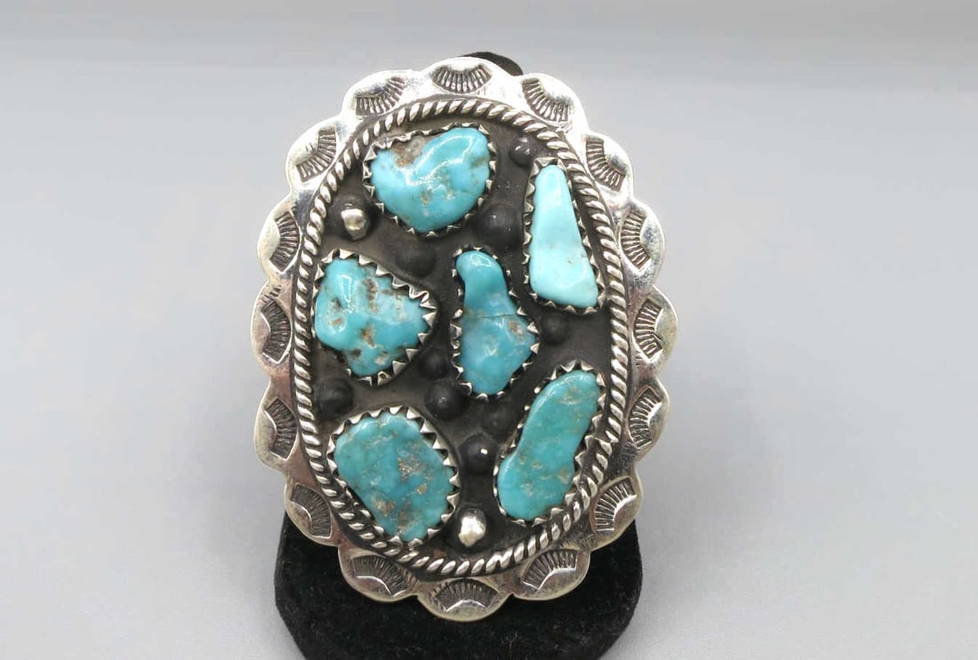 SILVER TURQUOISE FLOWER RING: SILVER TURQUOISE FLOWER RING. SIZE 8. Height: 2 3/8 in. by Width: 1 3/4 in. by Depth: 1/4 in.
