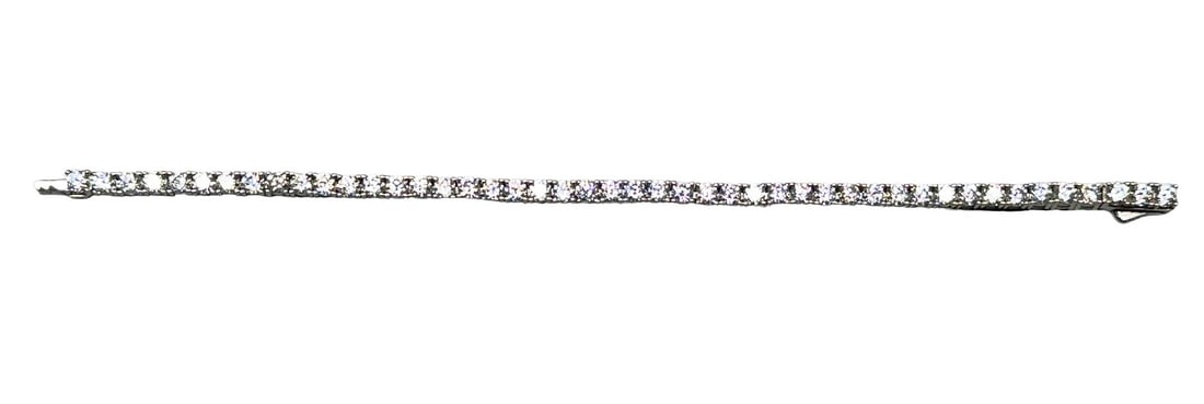 CZ DIAMOND S. S. TENNIS BRACELET: CZ DIAMOND S. S. TENNIS BRACELET. Height: 1/8 in. by Width: 1/8 in. by Depth: 7 in.