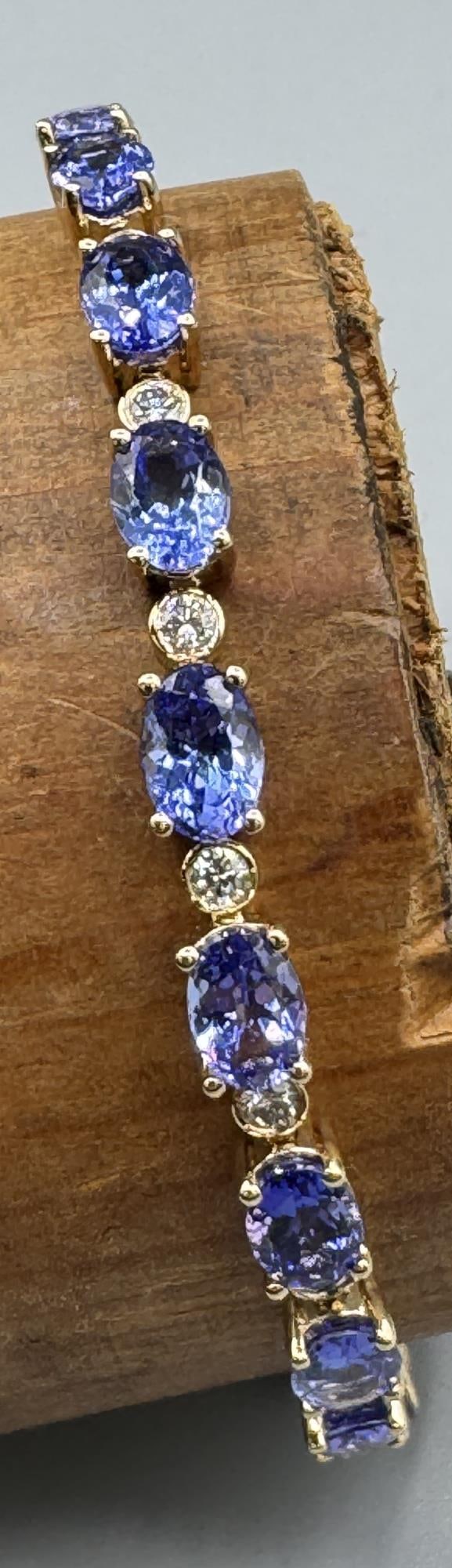 14K YELLOW GOLD TANZANITE 7" BRACELET: 14K YELLOW GOLD TANZANITE 7" BRACELET 14KY 8.05 GM TZ 20 13.44 RD 20 0.80 #7 INCH B2411588 31
