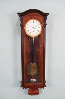 WILHELM WEIMER BIEDERMEIER WALL CLOCK: WILHELM WEIMER BIEDERMEIER WALL CLOCK. Height: 38.5 in. by Width: 12.5 in. by Depth: 6 in.