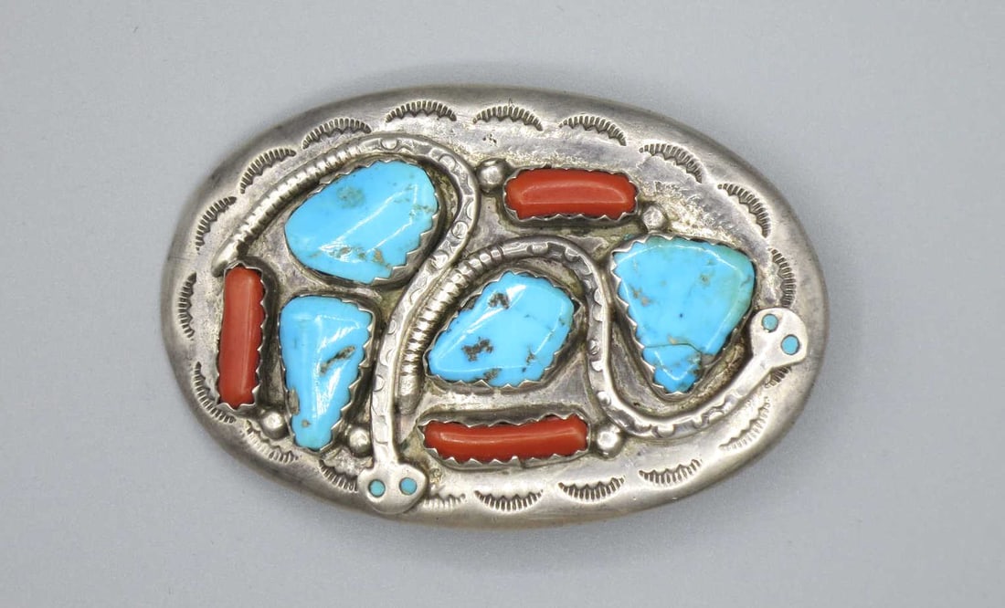 AMERICAN INDIAN SANTA FE BUCKLE: AMERICAN INDIAN SANTA FE SILVER TURQUOISE & CORAL SNAKE BUCKLE. Height: 2 in. by Width: 3 in. by Depth: .5 in.