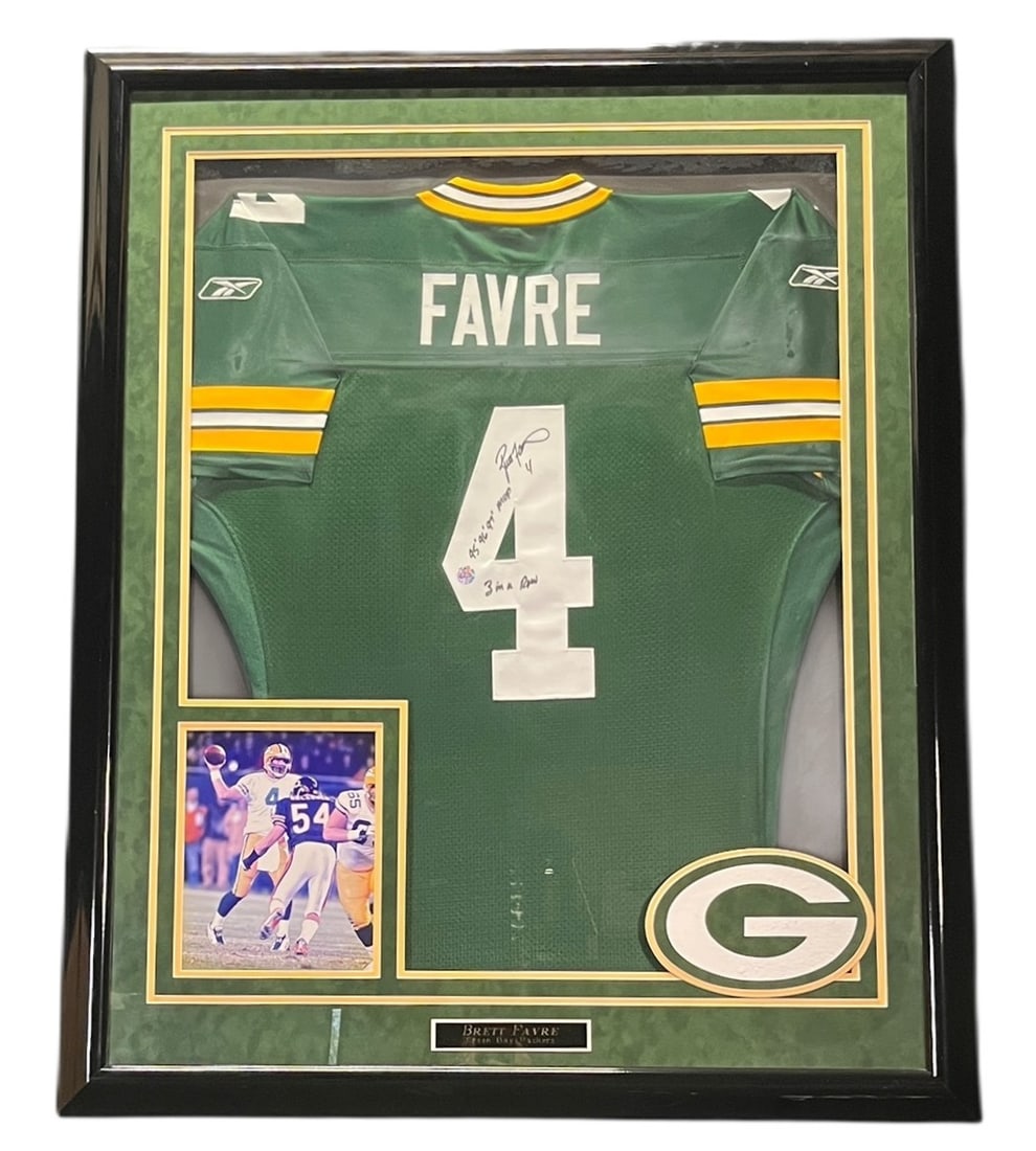 BRETT FARVE AUTOGRAPHED JERSEY FRAMED: BRETT FARVE AUTOGRAPHED JERSEY FRAMED Height: 43.5 in. by Width: 35.5 in. by Depth: 2 in.
