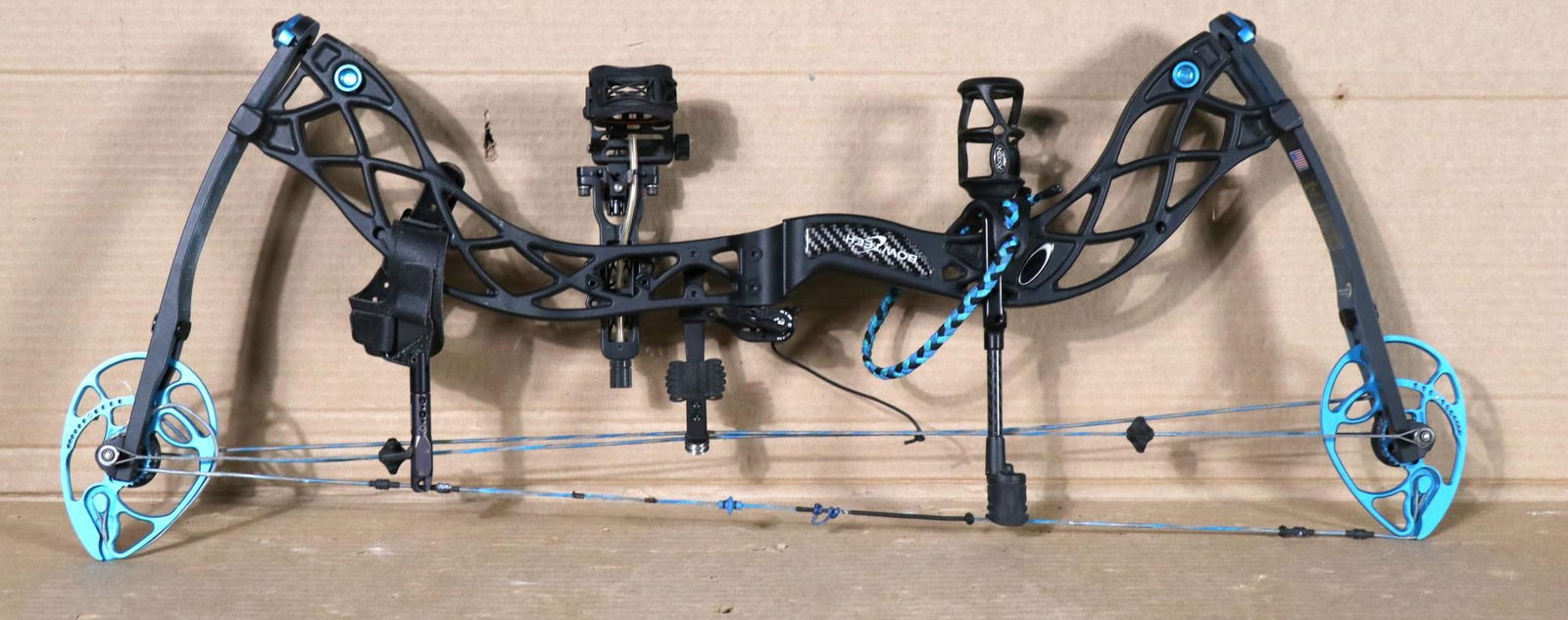 BOWTECH EVA SHOCKEY SS COMPOUND BOW: BOWTECH EVA SHOCKEY SS COMPOUND BOW. EQUIPED WITH AFTERMARKET ARROW REST, SIGHTS, DAMPER, ARROW RELEASE AND WRIST SLING. Height: 35 in. by Width: 13.5 in. by Depth: 4 in