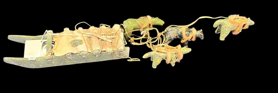 CARVED JADE ESKIMO ART: CARVED JADE ESKIMO ART. Height: 1 in. by Width: 21 in. by Depth: 5 IN.