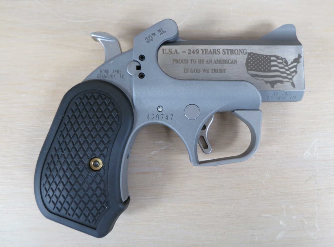 BOND ARMS ROUGH SERIES 30TH ANNIVERSARY XL PISTOL: BOND ARMS ROUGH SERIES 30TH ANNIVERSARY XL DERRINGER PISTOL 45 COLT/410 BORE. BREAK OPEN WEIGHS. 20 OZ. SERIAL 429747. (L884) Height: 4.5 in. by Width: 5.5 in. by Depth: 1.25 in.