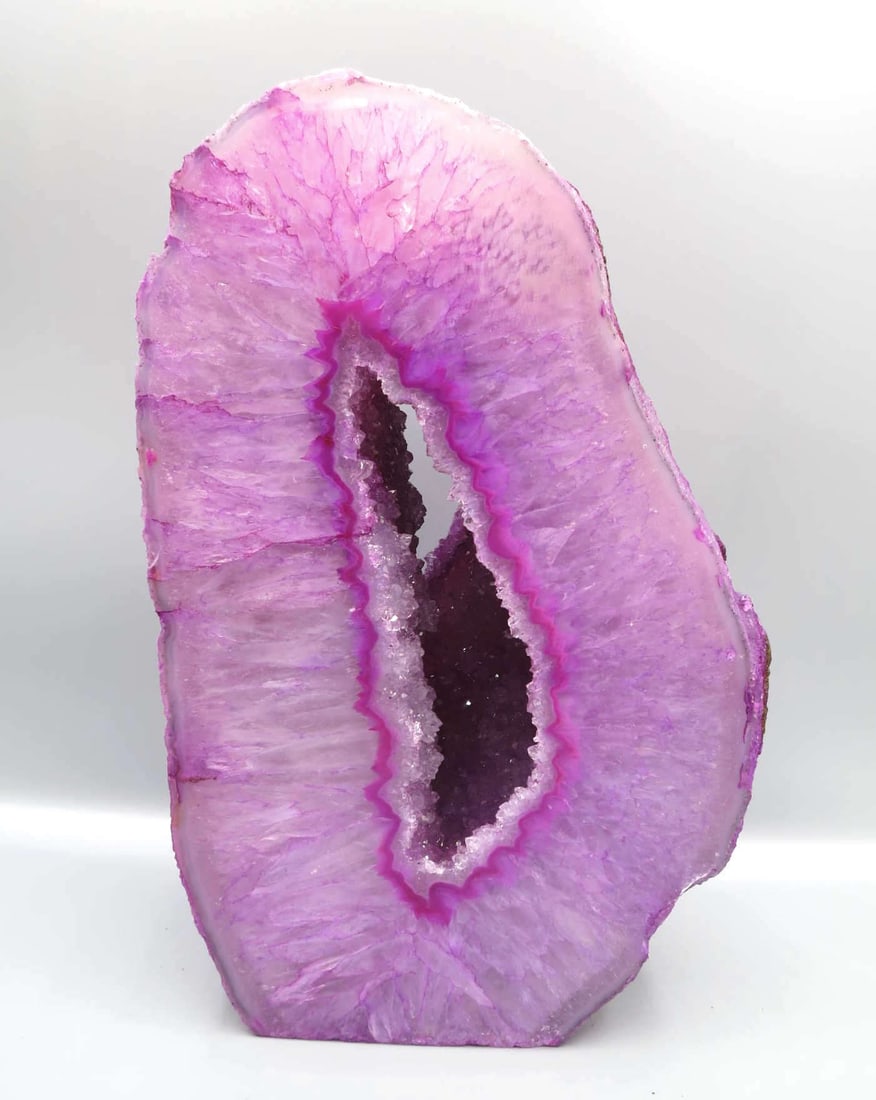 PINK AGATE GEODE: PINK AGATE GEODE. 3732 GRAMS. Height: 8 in. by Width: 5.5 in. by Depth: 3.5 in.