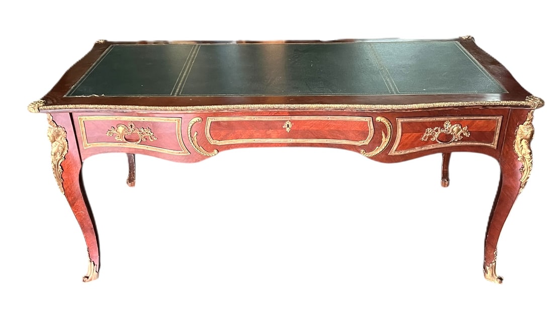 ANTIQUE FRENCH TOOLED LEATHER TOP DESK: ANTIQUE FRENCH TOOLED LEATHER TOP DESK WITH THREE DRAWERS. Floor to lowest point 21 inches. Height: 31 in. by Width: 69 in. by Depth: 33 in.