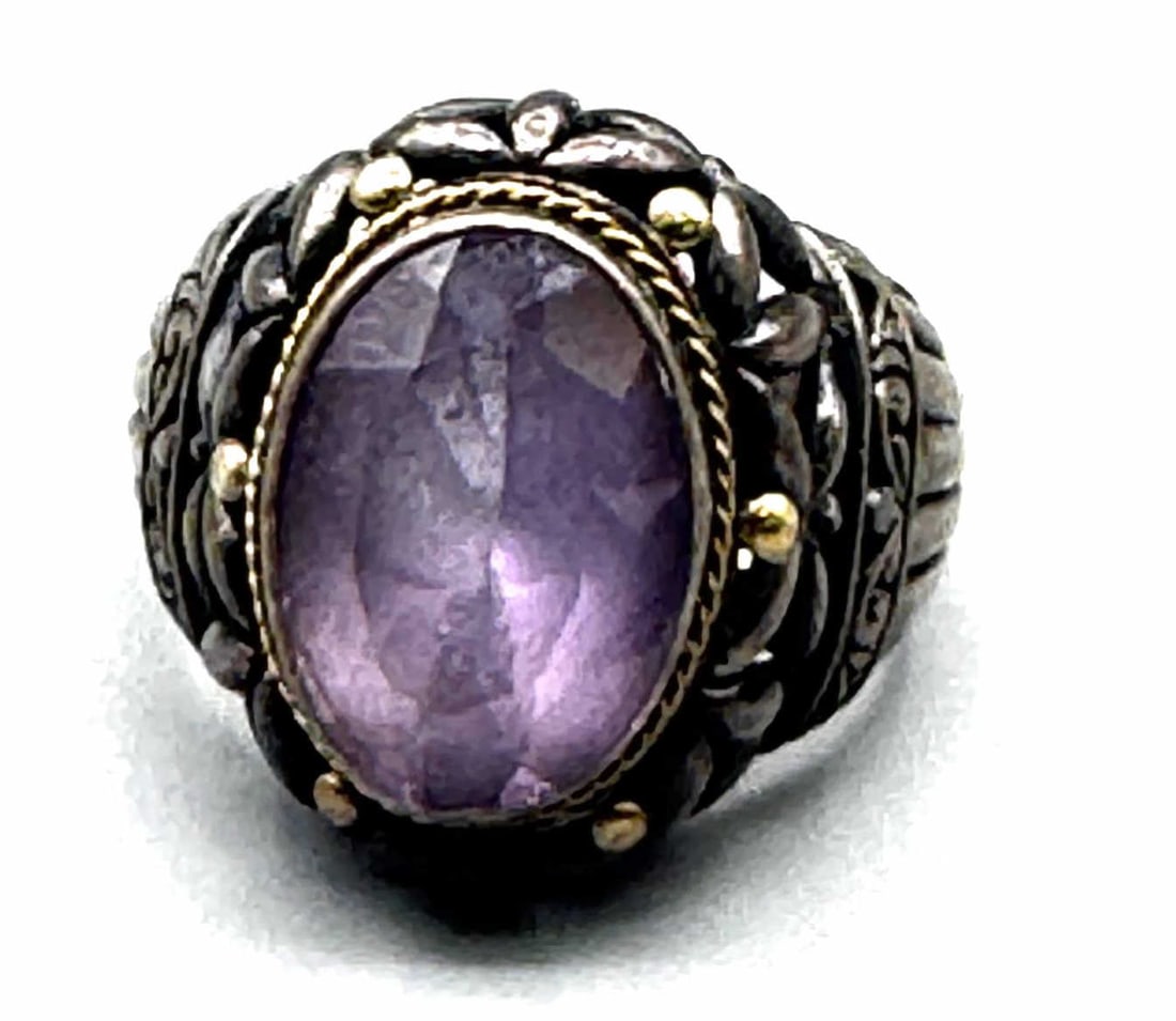 DAVID YURMAN AMETHYST RING: DAVID YURMAN AMETHYST RING CRAFTED WITH STERLING SILVER BAND AND A 14KT YELLOW GOLD BEZEL HOLDING FACETED AMETHYST STONE. SIZE 7. TOTAL WEIGHT: 8 GRAMS.