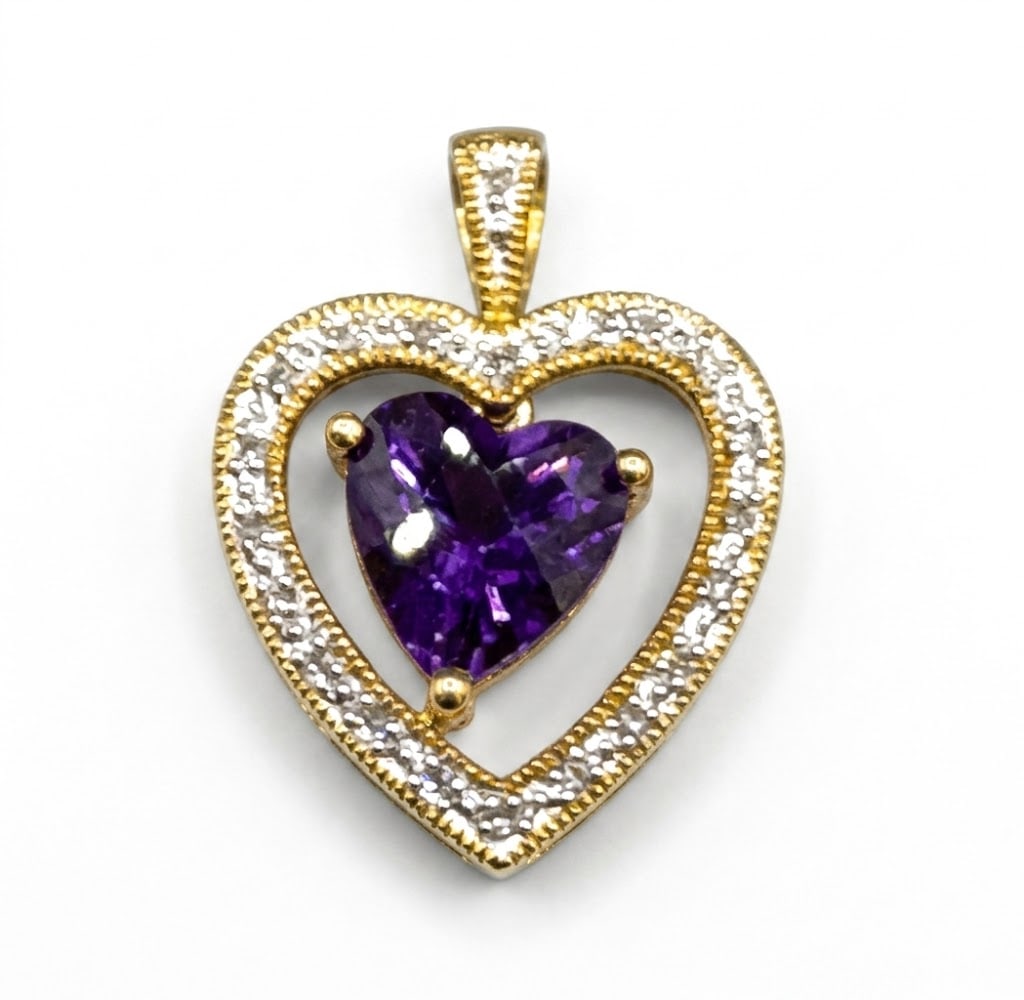 10KT GOLD AMETHYSTY & DIAMOND HEART PENDANT: 10KT GOLD AMETHYSTY & DIAMOND HEART PENDANT. 2 GRAMS T. W. Height: 3/4 in. by Width: 5/8 in. by Depth: 5/16 in.
