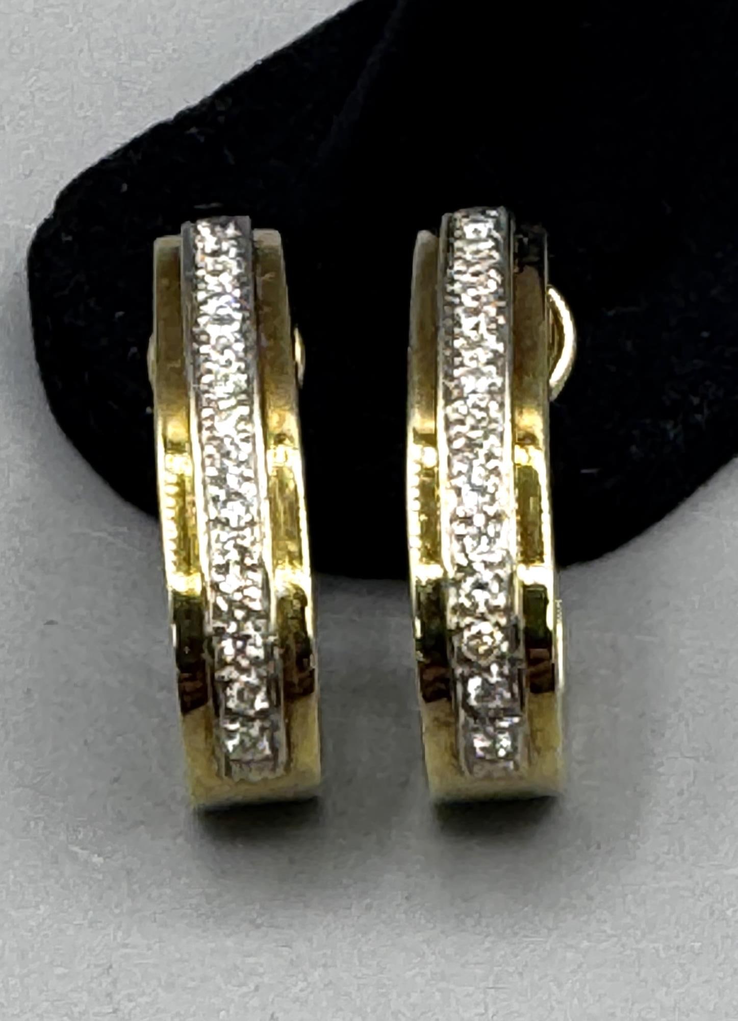 PAIR OF GOLD MICRO PAVE SET DIAMOND DROP EARRINGS: PAIR OF 14K GOLD MICRO PAVE SET DIAMOND DROP EARRINGS. 12 GRAMS T.W. Height: 1.25 in. by Width: .25 in. by Depth: 5/8 in.