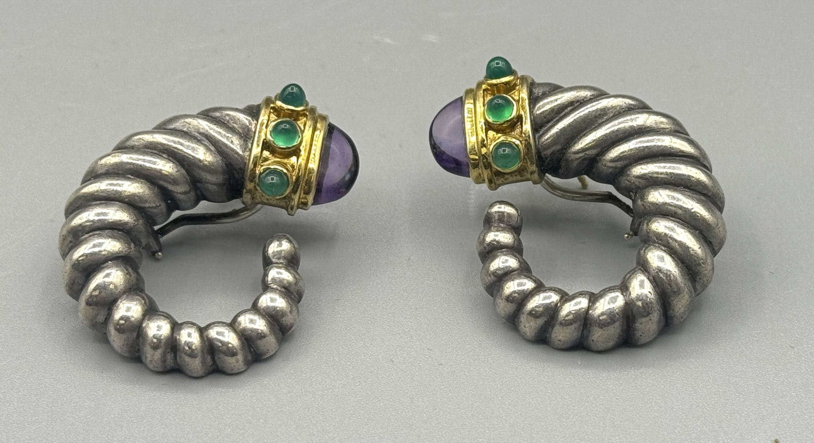 PAIR OF DAVID YURMAN RENAISSANCE SHRIMP EARRINGS: PAIR OF DAVID YURMAN RENAISSANCE SHRIMP EARRINGS CRAFTED FROM STERLING SILVER & 14KT GOLD END CAPS WITH AMETHYST AND EMERALD ACCENTS. 23 GRAMS T. W. Height: 1 1/4 in. by Width: 1 in. by Depth: 5/16
