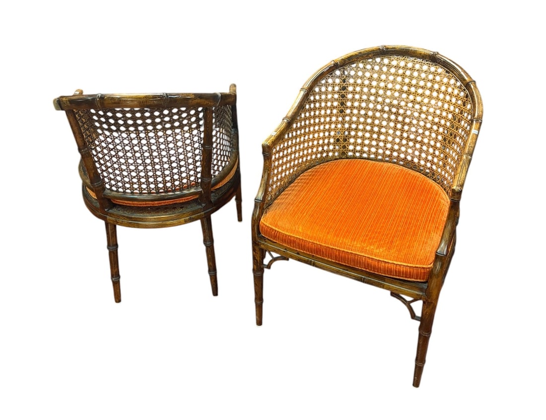 PAIR OF MID-CENTURY CANE AND FAUX BAMBOO ARMCHAIRS: PAIR OF MID-CENTURY CANE AND FAUX BAMBOO ARMCHAIRS WITH UPHOLSTERED SEATS. Height: 33 in. by Width: 22.8 in. by Depth: 29 in.