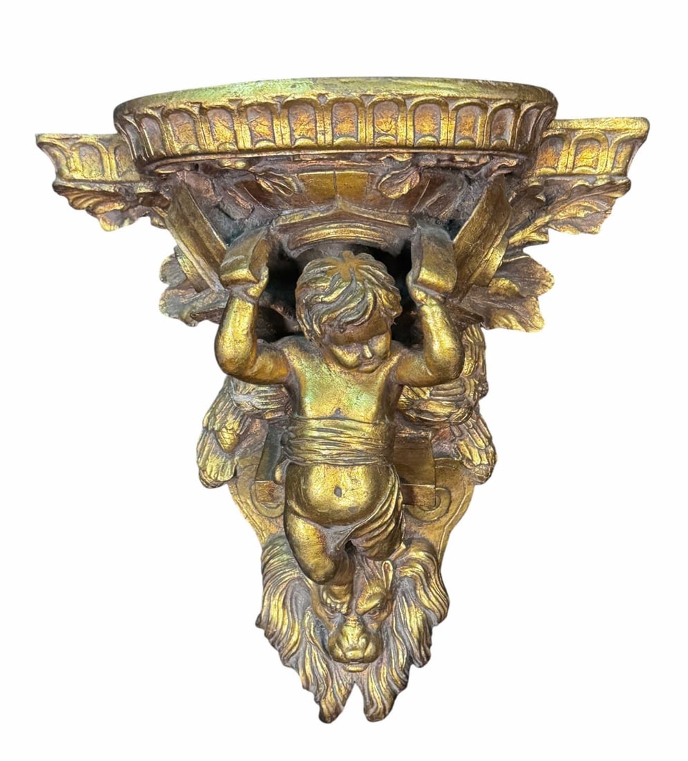 CARVED AND GILDED PUTTI WALL BRACKET: CARVED AND GILDED PUTTI WALL BRACKET. Height: 14