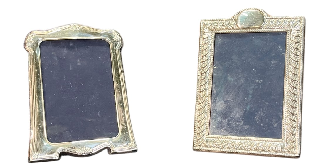 TWO STERLING SILVER FRAMES: TWO STERLING SILVER FRAMES. Height: 8 in. by Width: 5.5 in.