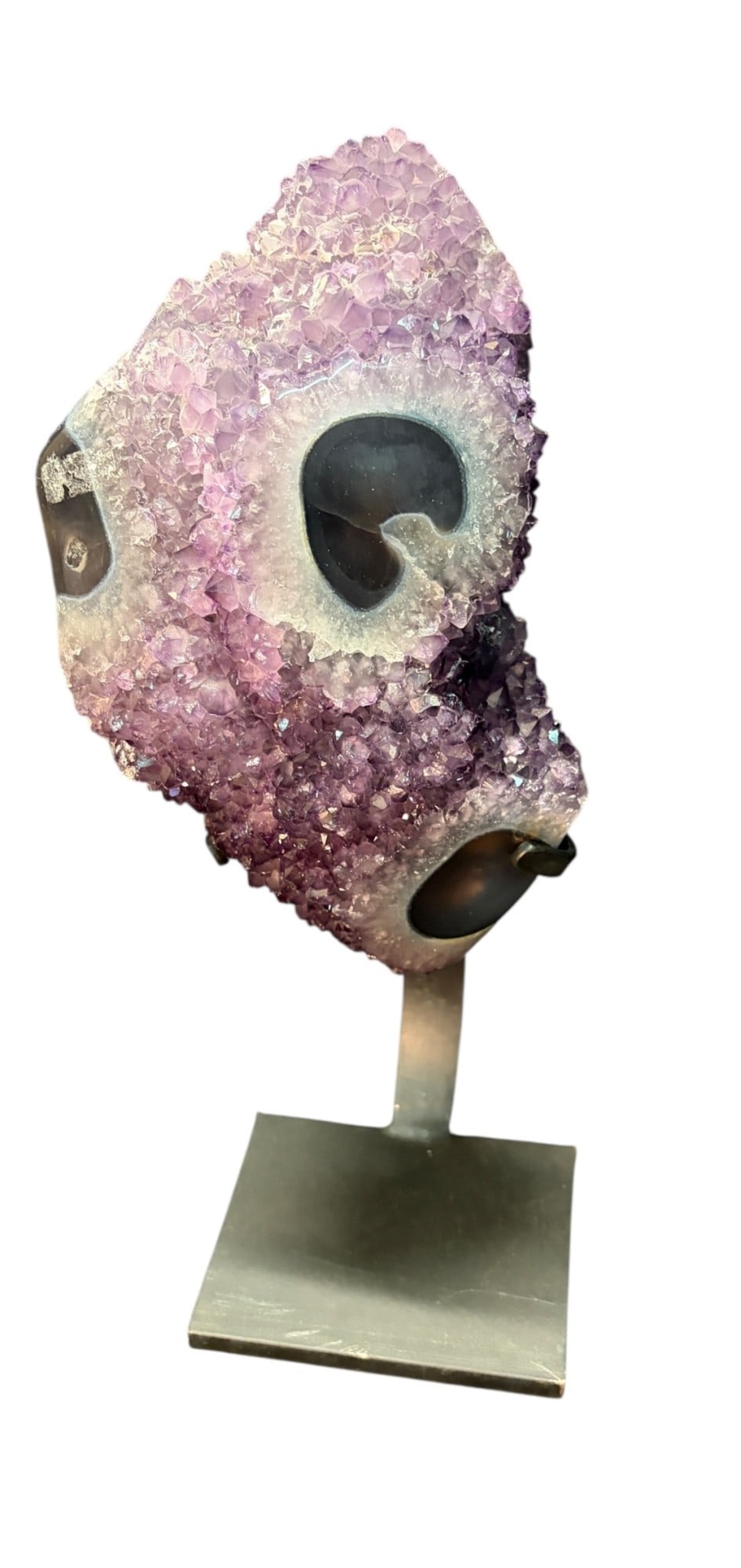 AMETHYST ON IRON STAND: AMETHYST ON IRON STAND. 8.30kg. Height: 15 in. by Width: 8 in. by Depth: 4 in.
