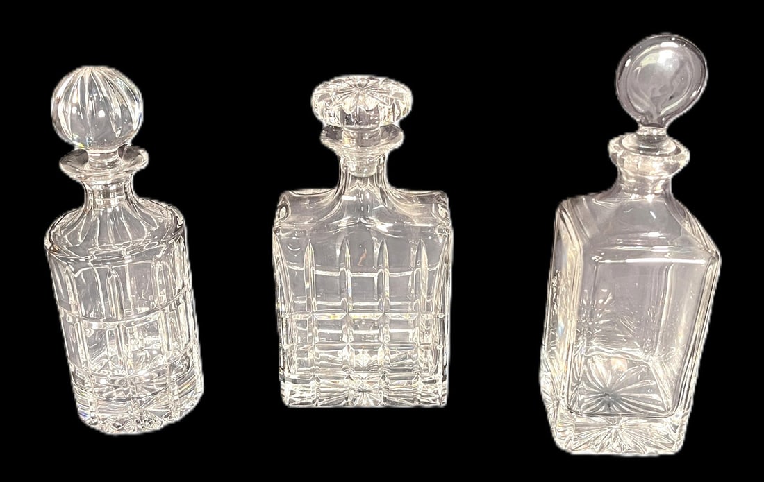 THREE CRYSTAL CUT GLASS DECANTERS (1 of 4)