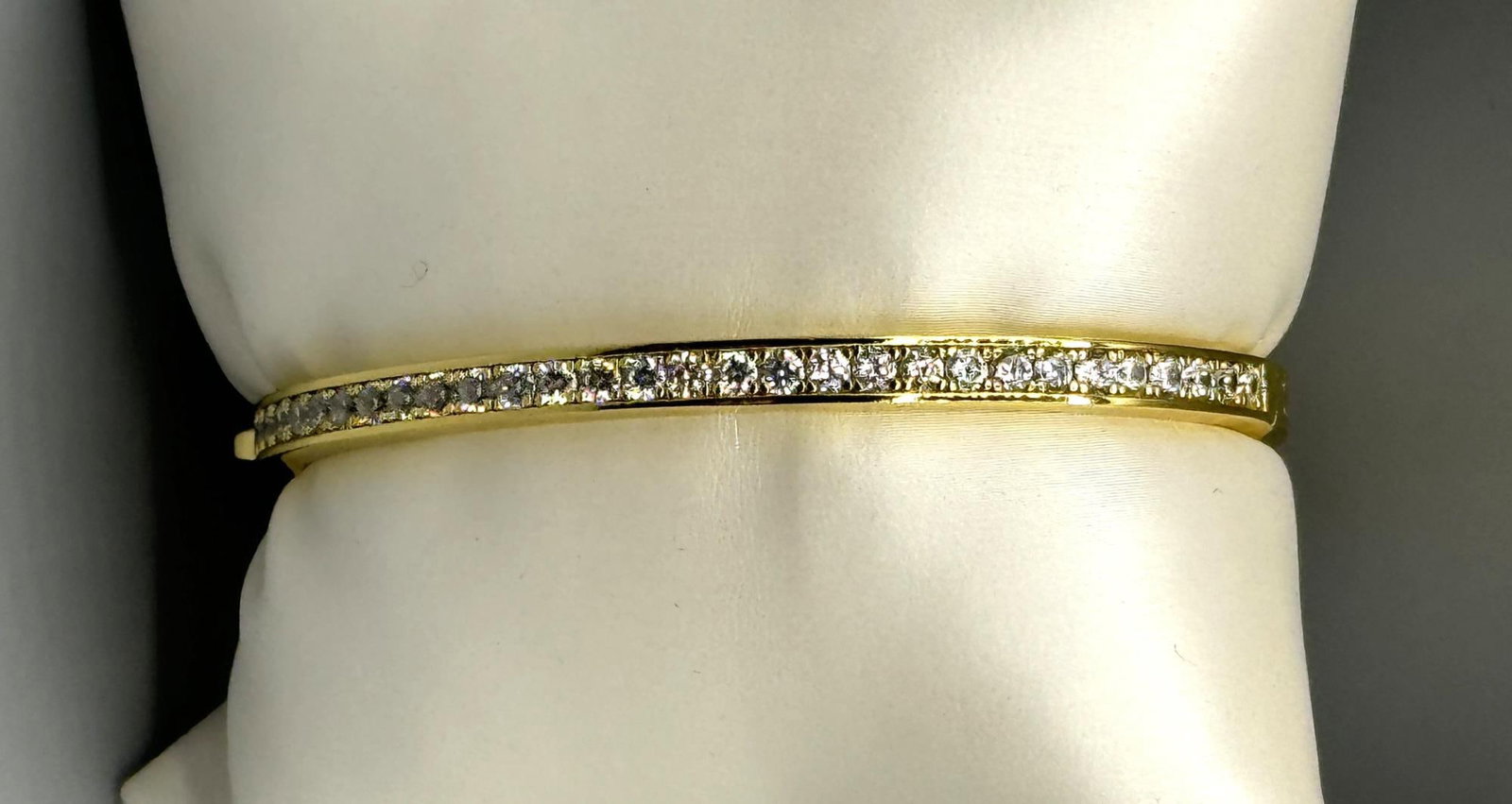 WHITE SAPPHIRE BANGLE BRACELET IN GOLD WASH: WHITE SAPPHIRE BANGLE BRACELET IN GOLD WASH STERLING.