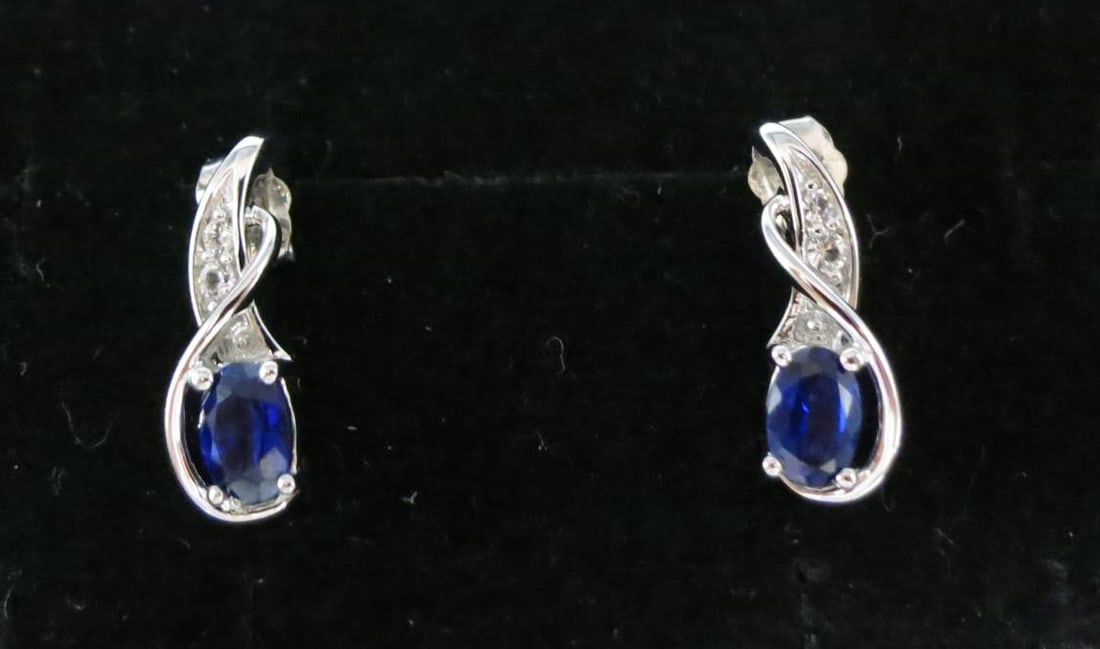 PAIR OF BLUE & WHITE SAPPHIRE STERLING EARRINGS: PAIR OF BLUE & WHITE LAB SAPPHIRE STERLING EARRINGS. Height: 11/16 in. by Width: 3/8 in. by Depth: 3/16 in.