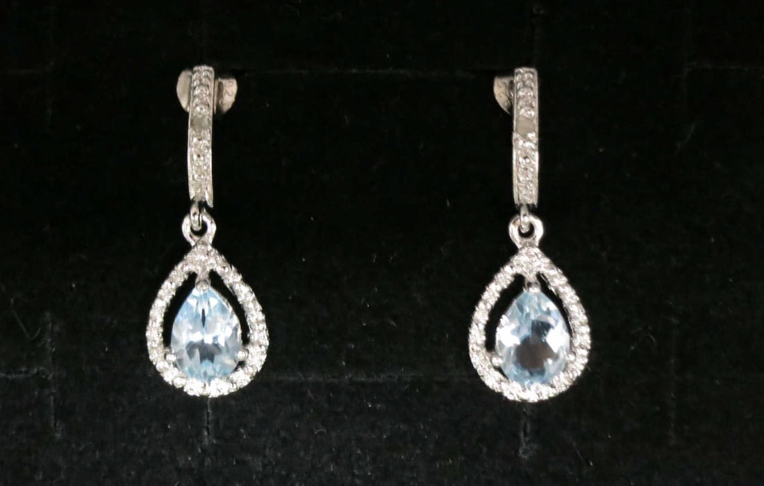 PAIR OF BLUE & WHITE CRYSTAL TEAR DROP EARRINGS: PAIR OF BLUE & WHITE CRYSTAL TEAR DROP STERLING SILVER EARRINGS. Height: 1 in. by Width: 5/16 in. by Depth: 1/8 in.
