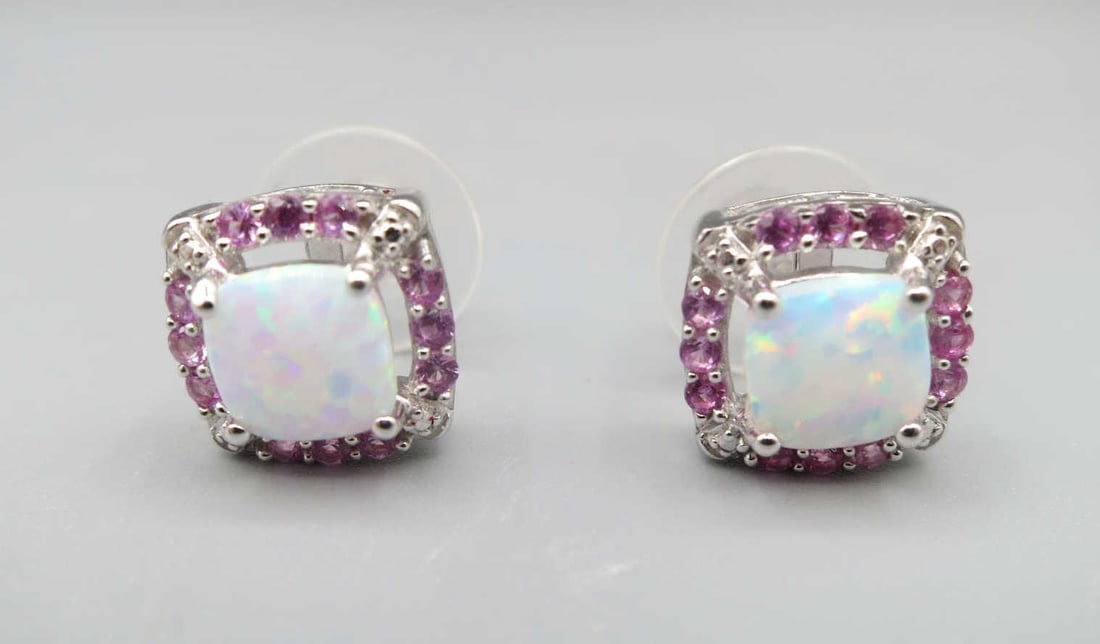 PAIR OF WHITE OPAL MICRO PAVE CZ EARRINGS: PAIR OF WHITE OPAL MICRO PAVE CZ EARRINGS. Height: 3/8 in. by Width: 3/8 in. by Depth: 1/4 in.