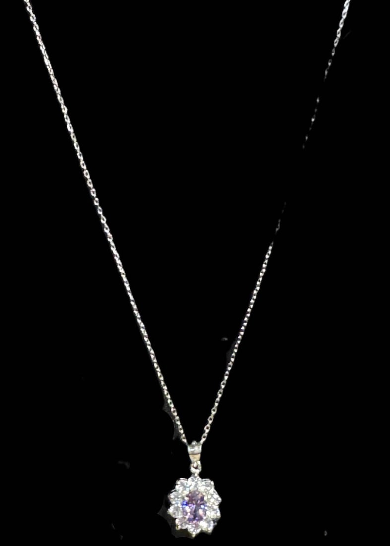 AMETHYST & CZ DIAMOND NECKLACE: AMETHYST & CZ DIAMOND NECKLACE IN STERLING SILVER. ADJUSTABLE 16 TO 18 INCHES. Height: 1/2 in. by Width: 7/16 in.
