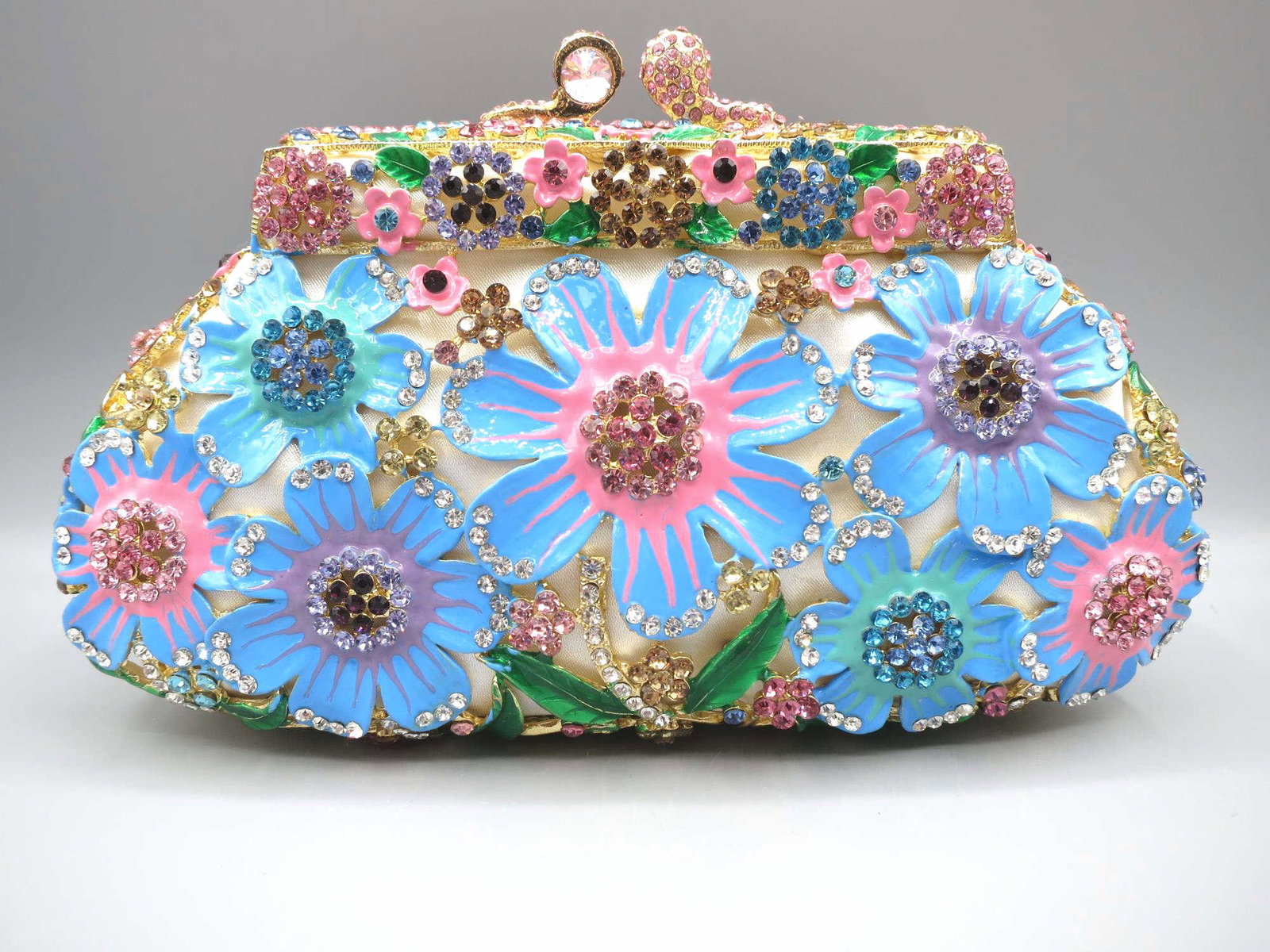 CRYSTAL EMBELLISHED DAISY MOTIF CLUTCH: CRYSTAL EMBELLISHED DAISY MOTIF CLUTCH IN PRESENTATION BOX. Height: 5 in. by Width: 7.5 in. by Depth: 3 in.
