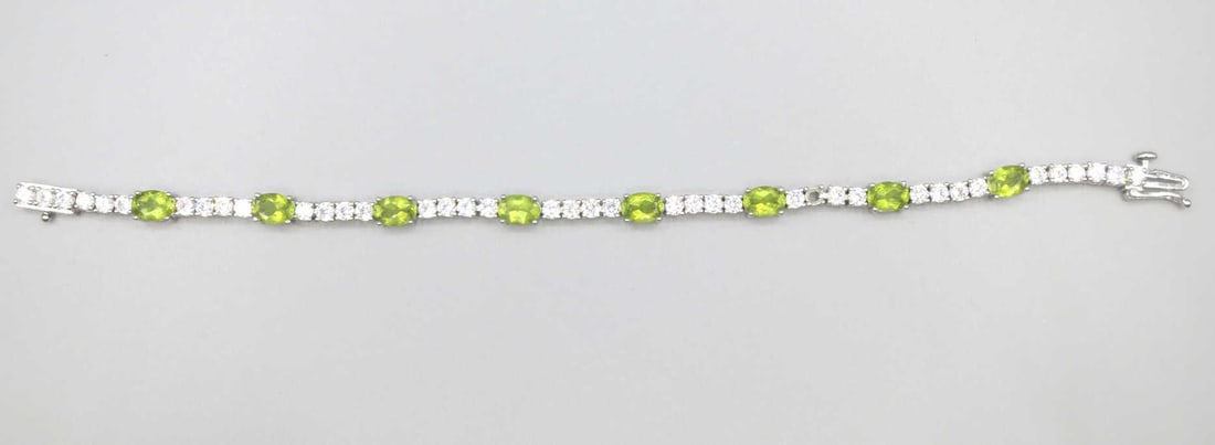 CZ PERIDOT & DIAMOND STERLING SILVER BRACELET: CZ PERIDOT & DIAMOND STERLING SILVER BRACELET. Height: 3/16 in. by Width: 7 in. by Depth: 3/16 in.