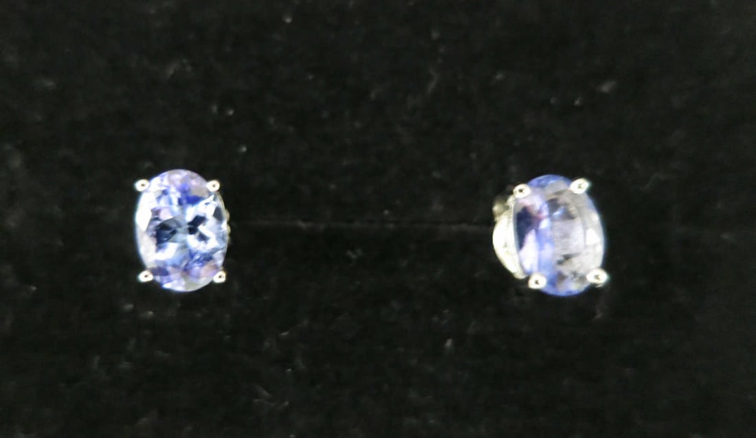 PAIR OF LAB SAPPHIRE STUD EARRINGS: PAIR OF LAB SAPPHIRE STUD EARRINGS IN FOUR PRONG STERLING SILVER SETTING. Height: 1/4 in. by Width: 1/8 in. by Depth: 3/16 in.