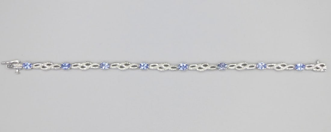 CZ AQUAMARINE STERLING SILVER BRACELET: CZ AQUAMARINE STERLING SILVER BRACELET. Height: 3/16 in. by Width: 7 in. by Depth: 3/16 in.
