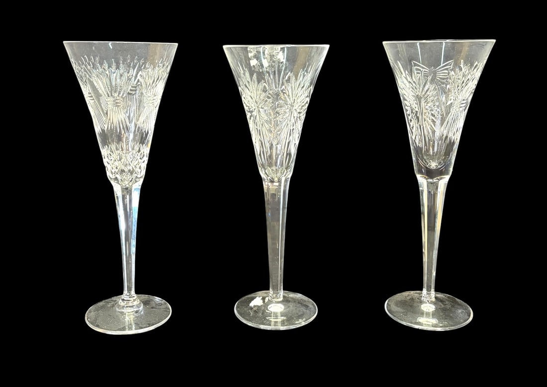 THREE WATERFORD CRYSTAL CHAMPAGNE FLUTES: THREE WATERFORD CRYSTAL CHAMPAGNE FLUTES. Height: 9.2 in. by Width: 3.5 in. by Depth: 3.5 in.