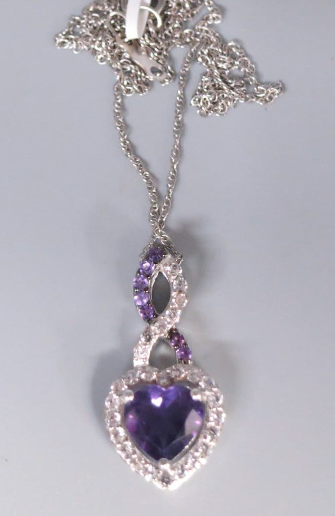 AMETHYST & WHITE SAPPHIRE PENDANT NECKLACE: AMETHYST & WHITE SAPPHIRE PENDANT NECKLACE. 16". Height: 1 in. by Width: 1/2 in. by Depth: 3/16 in.