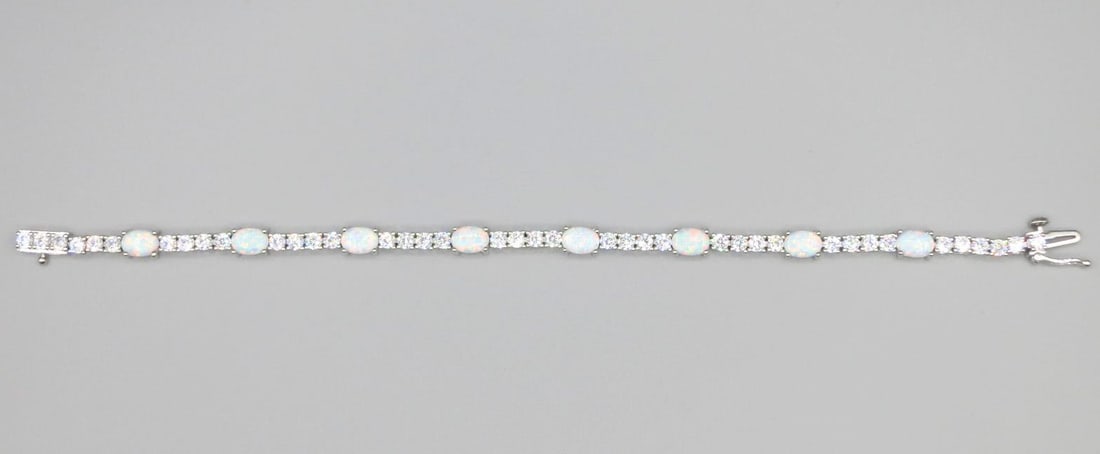 OPAL & CZ STERLING SILVER BRACELT: OPAL & CZ STERLING SILVER BRACELET. Height: 3/16 in. by Width: 7 in. by Depth: 3/16 in.