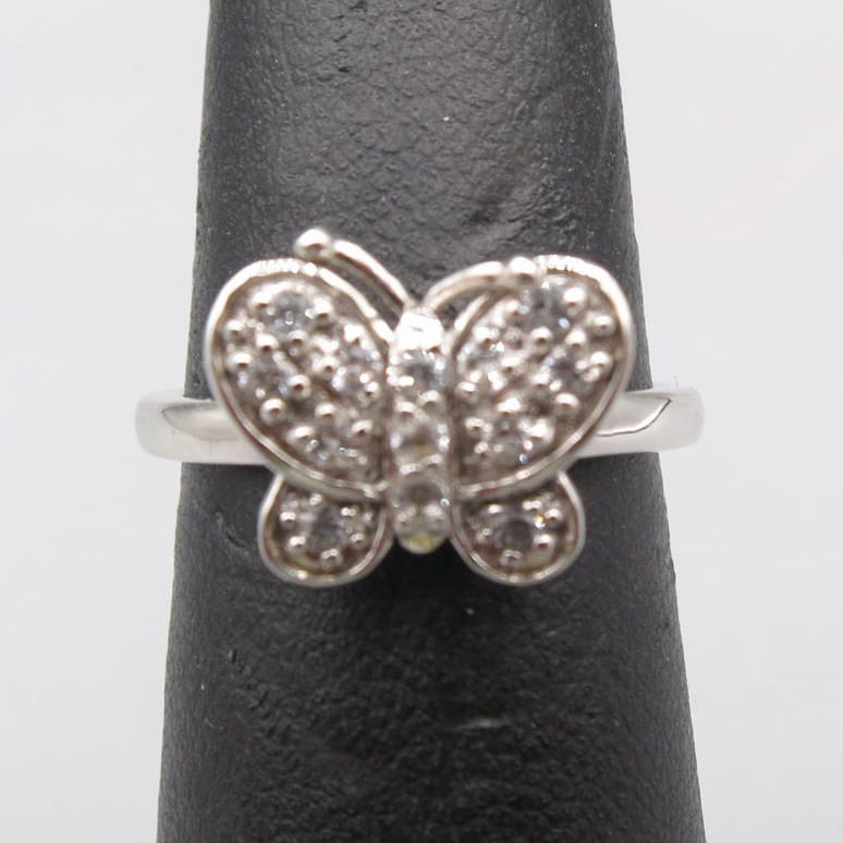 WHITE TOPAZ STERLING SILVER BUTTERFLY RING: WHITE TOPAZ STERLING SILVER BUTTERFLY RING. SIZE 7.