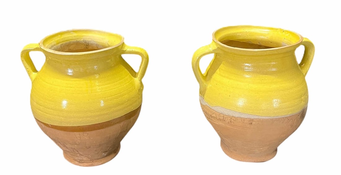 TWO YELLOW GLAZED CERAMIC POTS: TWO YELLOW GLAZED CERAMIC POTS. Height: 10 in. by Width: 10 in. by Depth: 10 in.