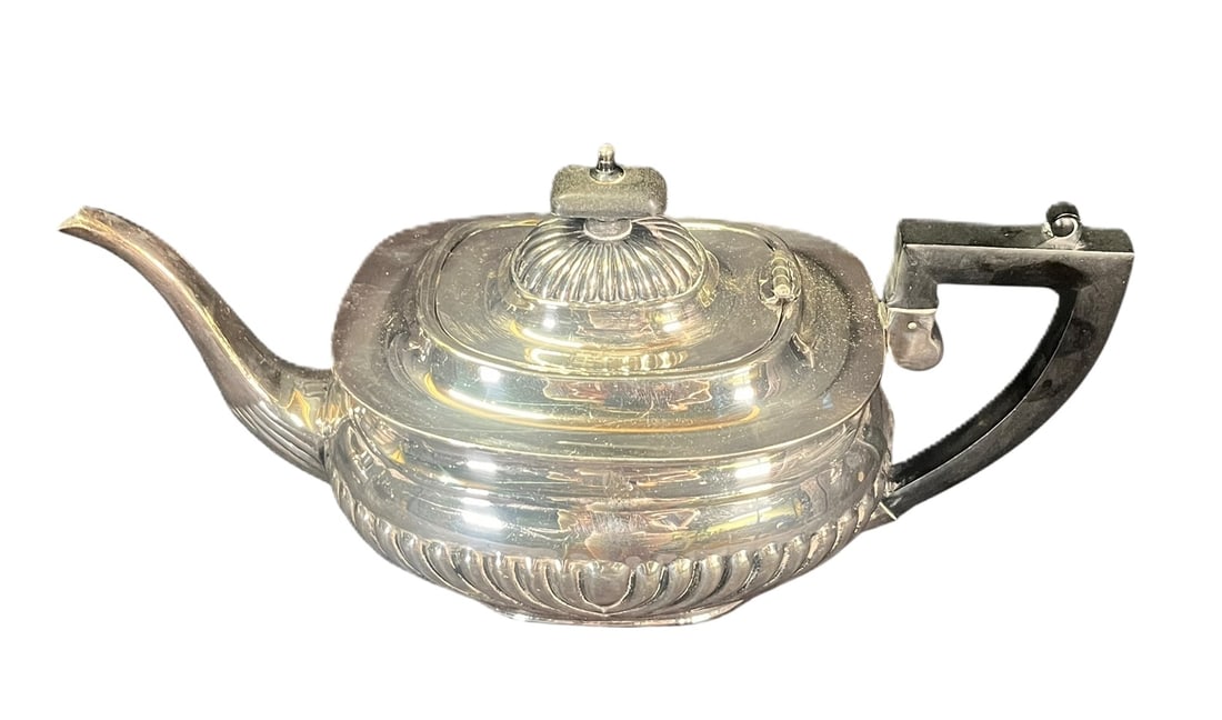 ART DECO STYLE SILVER PLATE TEAPOT: ART DECO STYL SILVER PLATE TEAPOT WITH BLACK HANDLE. Height: 6 in. by Width: 12 in. by Depth: 5 IN.