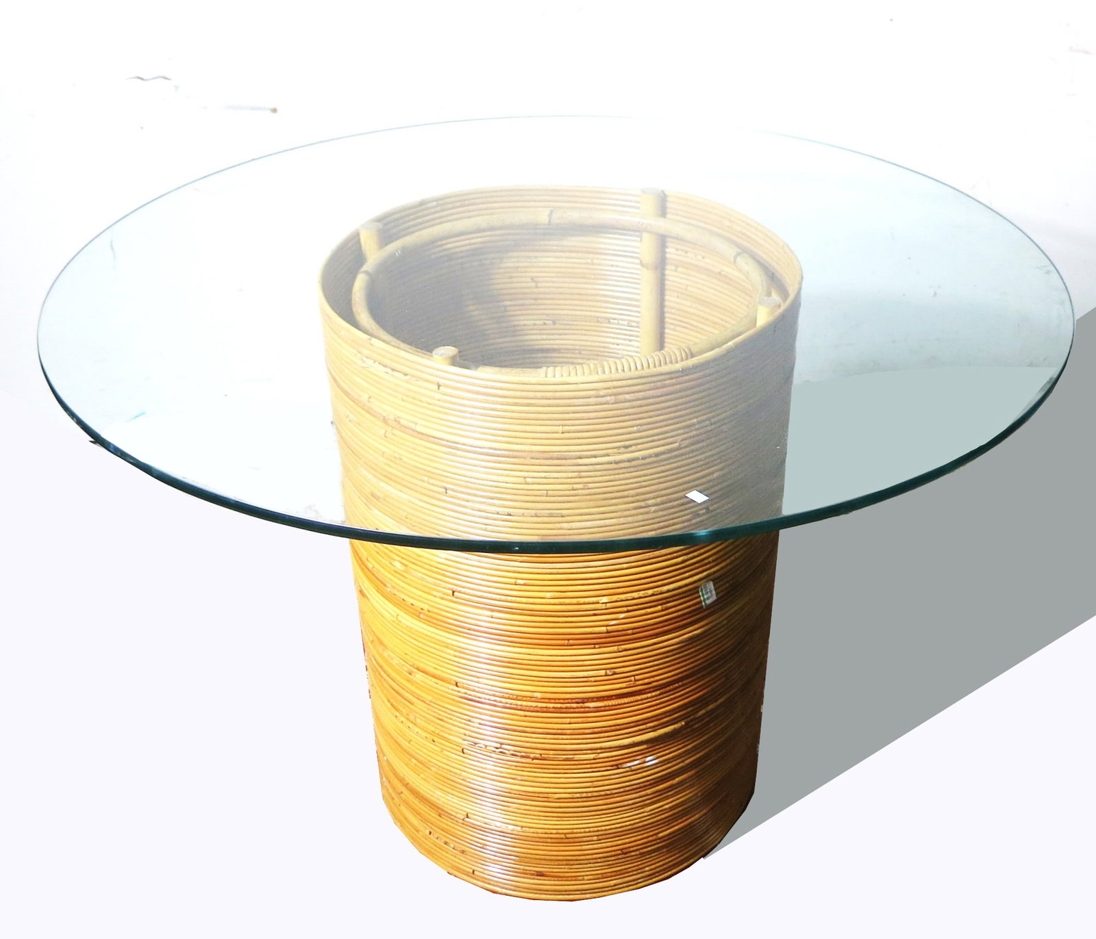 VINTAGE GLASS TOP DINING TABLE ON RATTAN BASE: VINTAGE GLASS TOP DINING TABLE ON RATTAN BASE.