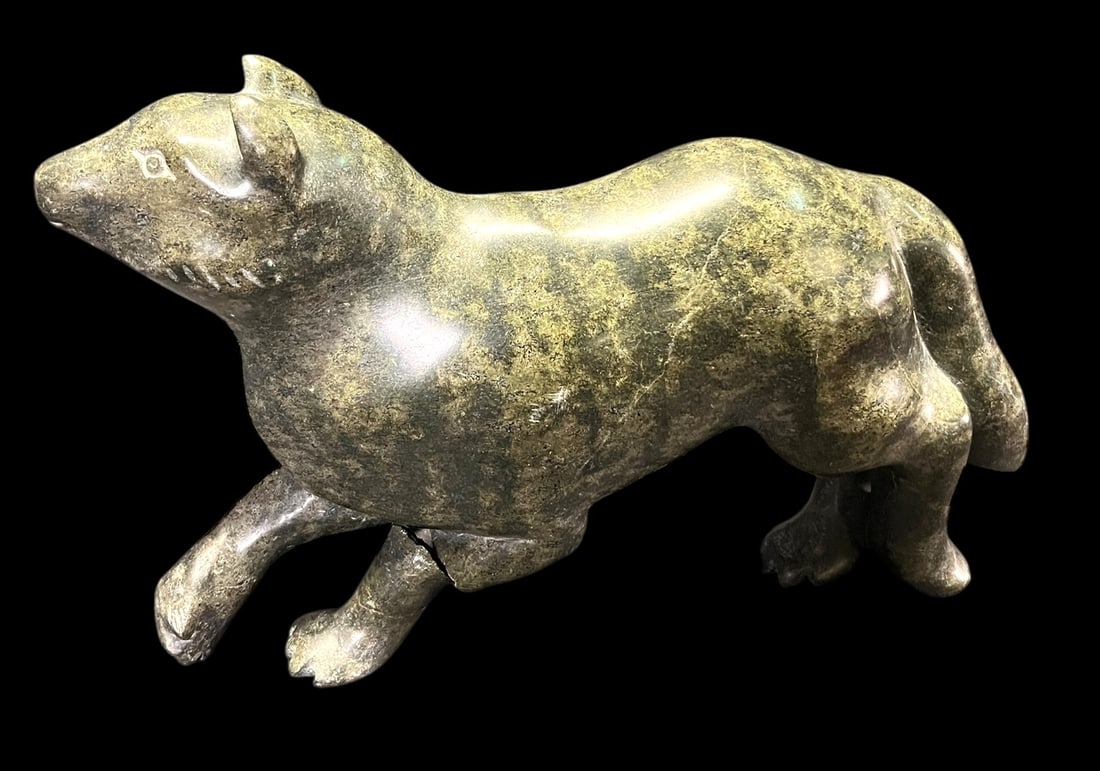 ESKIMO ART CARVED GREEN MINERAL STONE OF DOG: ESKIMO ART CARVED GREEN MINERAL STONE OF DOG. Height: 10 in. by Width: 14 in. by Depth: 5 IN.