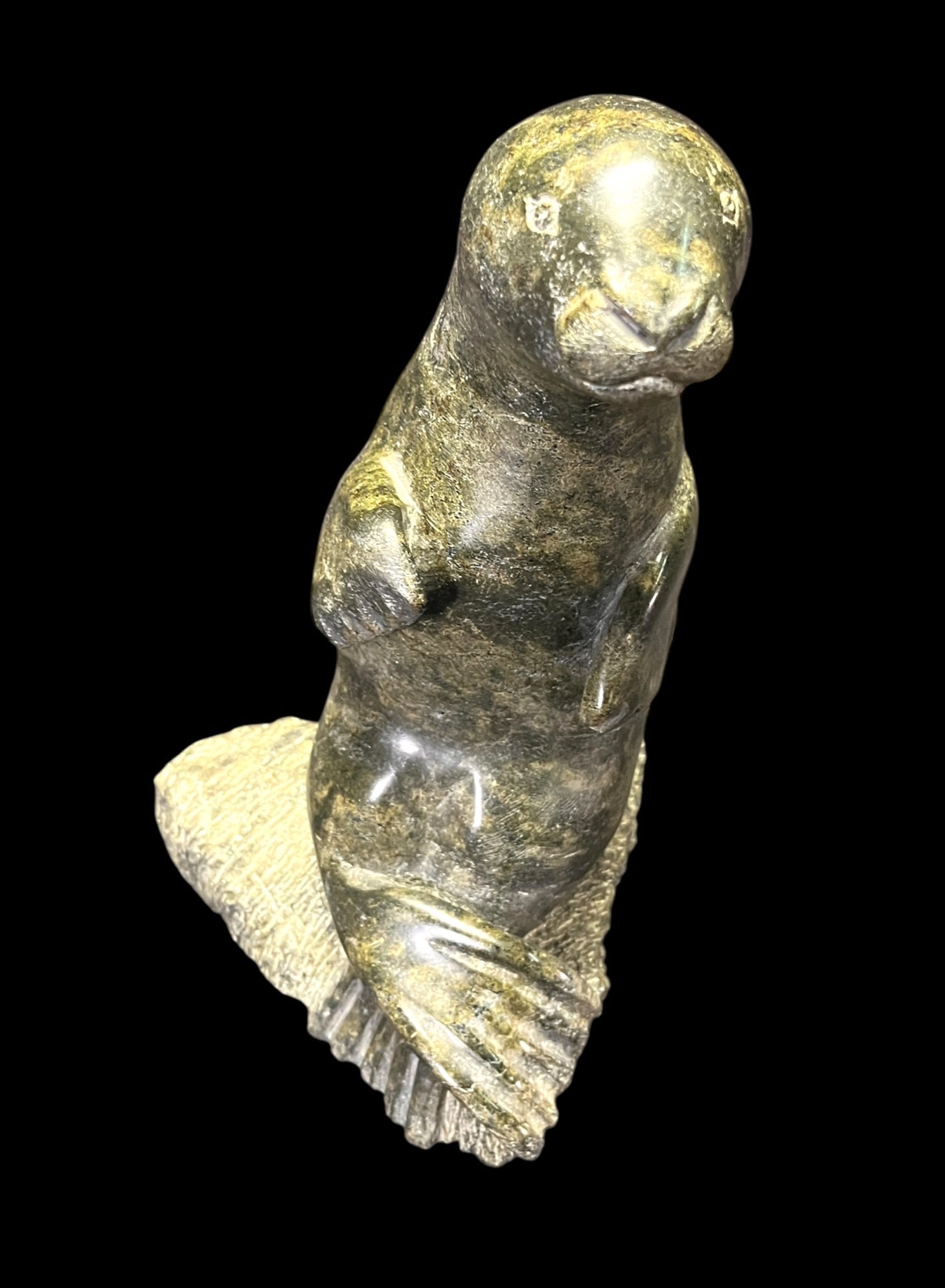 ESKIMO ART CARVED STONE SEAL SCULPTURE: ESKIMO ART CARVED STONE SEAL SCULPTURE. Height: 11 in. by Width: 7 in. by Depth: 7.5 in.