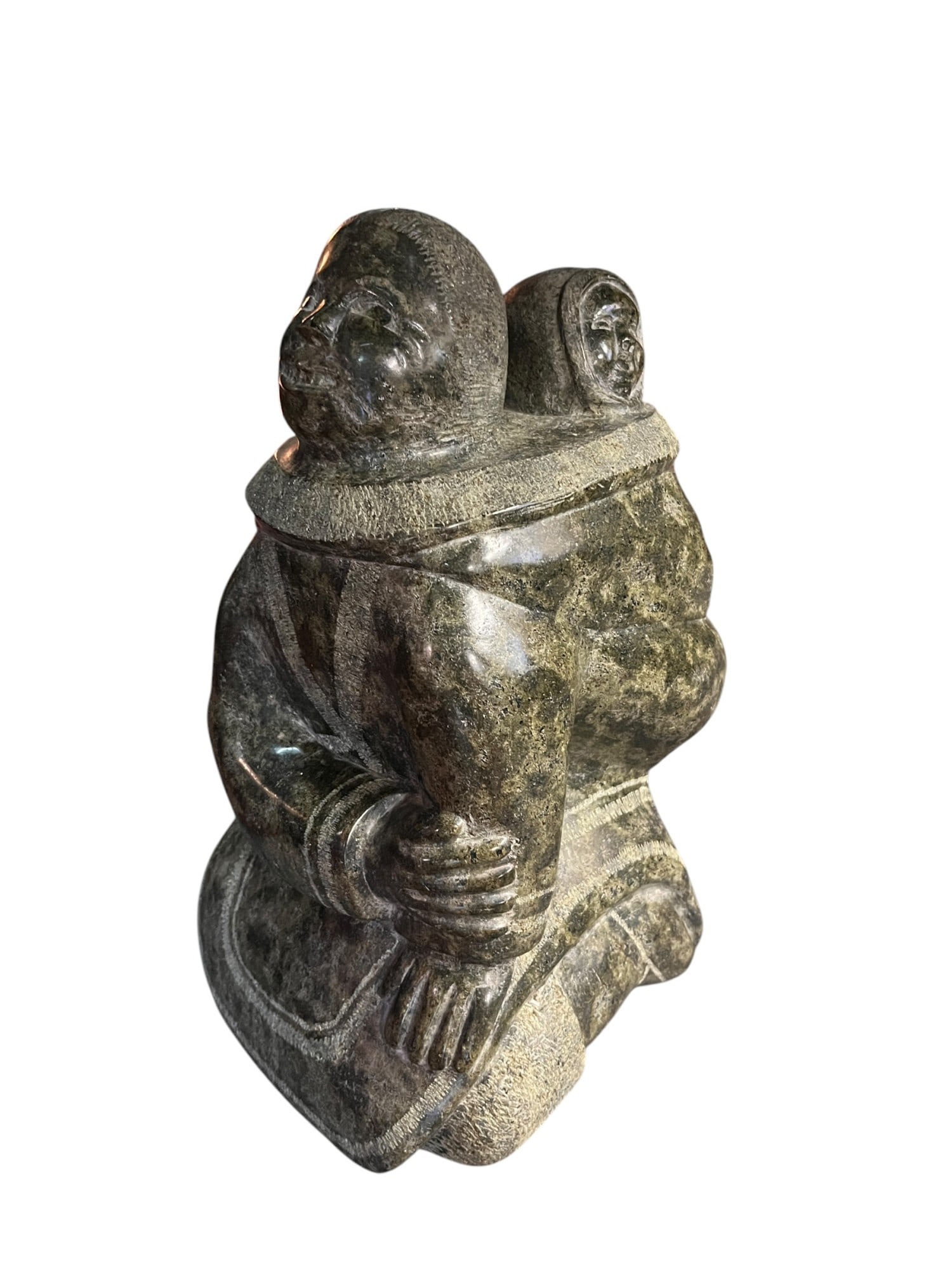 ESKIMO MOTHER AND CHILD CARVED STONE FIGURE: ESKIMO MOTHER AND CHILD CARVED STONE FIGURE. Height: 15 in. by Width: 10.5 in. by Depth: 8.5 in.
