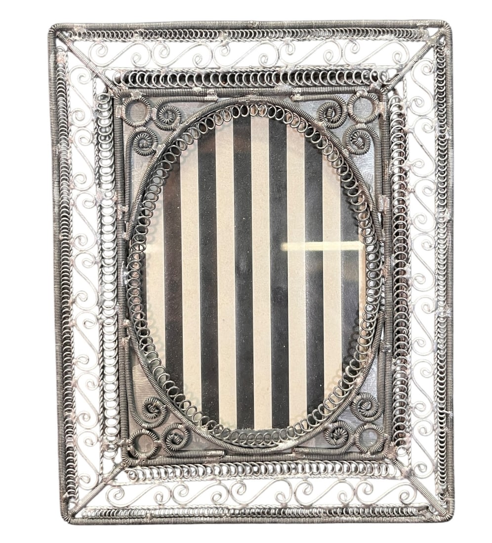 FOUR METAL DECORATIVE FRAMES - 4