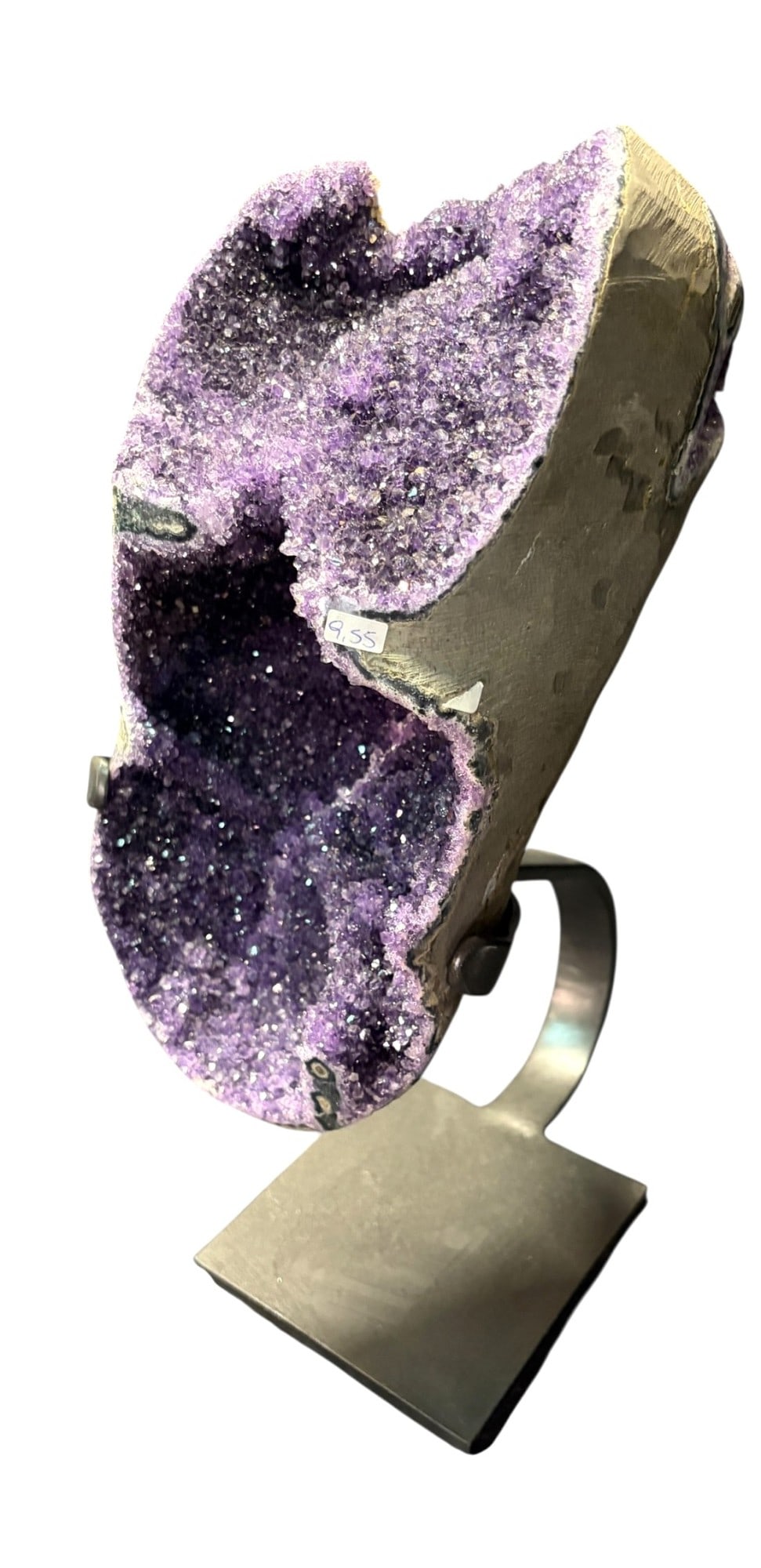 AMETHYST CRYSTAL ON IRON STAND: AMETHYST CRYSTAL ON IRON STAND. 9,550 Grams. Height: 13 in. by Width: 6.5 in. by Depth: 5.5 in.