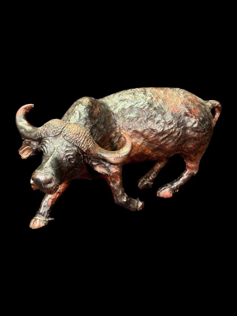 WATER BUFFALO SCULPTURE: WATER BUFFALO SCULPTURE W/ DARK BRONZE LIKE FINISH Height: 9.5 in. by Width: 17 in. by Depth: 7.5