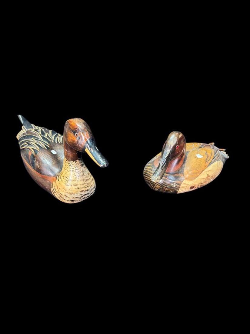 2 HAND CARVED WOODEN DUCKS: TWO HAND CARVED WOOD DUCKS BY WOODDARE INC. CARVED BY TOM TABER JERSEY AND KYLE JR WITH AUTHENTICITY BRONZE MEDALLION 1982 SERIES Height: 8 in. by Width: 7 in. by Depth: 16