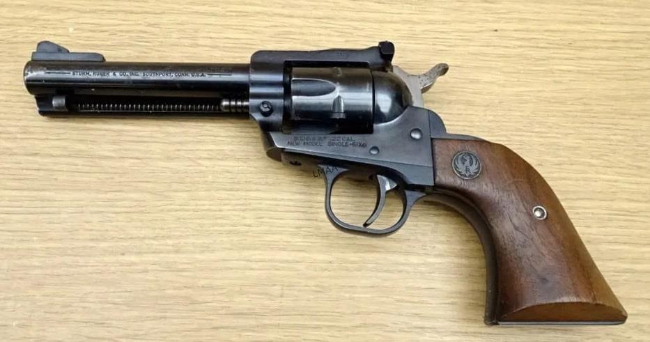 Ruger NEW MODEL SINGLE SIX .22 LR Revolver: Ruger NEW MODEL SINGLE SIX .22 LR Revolver. Good condition,4 5/8" Barrel. Shiny Bore, Tight Action Features a 6 Shot Fluted Cylinder, Serrated Hammer Spur, Side Gate Loading, Smooth Wood Grips with Ru