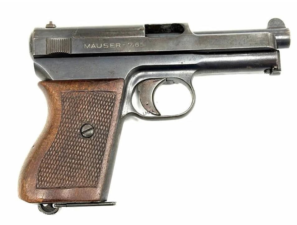 Mauser 1934 7.65 Caliber Semi Automatic Pistol: Mauser Model 1934 7.65 Caliber Semi Automatic Pistol. The Mauser model 1934 is in used condition.? Barrel measures 4 inches in length. Slide and frame do obtain pitting, wood walnut checkered grips
