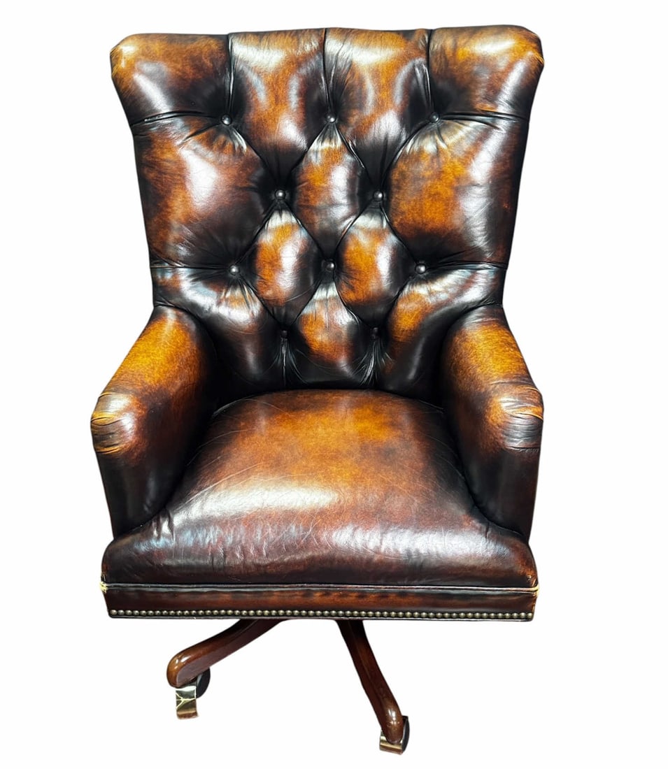 BUTTON-TUFTED LEATHER OFFICE CHAIR: BUTTON-TUFTED LEATHER OFFICE CHAIR ON CASTERS. Height: 43 in. by Width: 27 in. by Depth: 29 in.