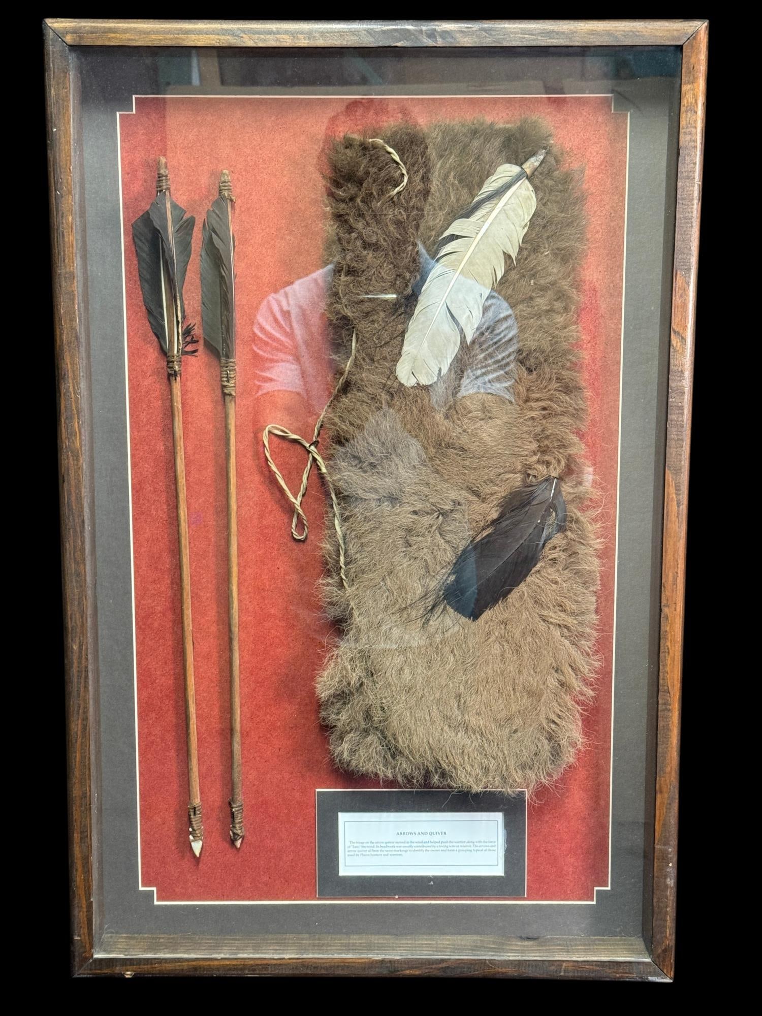 NATIVE AMERICAN-STYLE ARROWS AND QUIVER DISPLAY: NATIVE AMERICAN-STYLE ARROWS AND QUIVER DISPLAY. FRAMED PRESENTATION FEATURING A FUR-COVERED QUIVER WITH FEATHER DECORATION AND TWO ARROWS WITH FEATHER FLETCHING & POINTED TIPS. INCLUDES