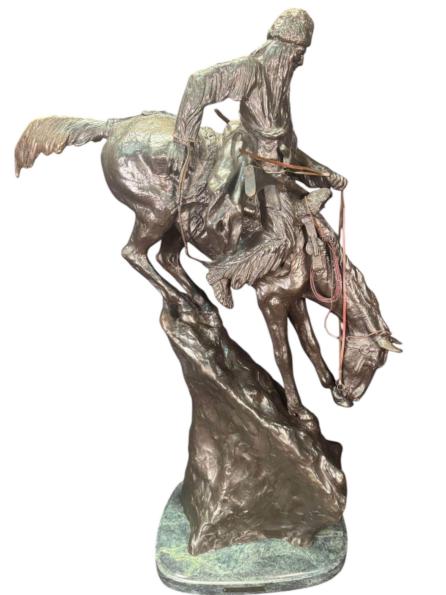 FREDERIC REMINGTON "THE MOUNTAIN MAN": FREDERIC REMINGTON (AMERICAN,.1861-1909) "THE MOUNTAIN MAN" LARGE PATINATED BRONZE SCULPTURE DEPICTING A FRONTIERSMAN ON HORSEBACK. Height: 30 in. by Width: 20 in. by Depth: 11