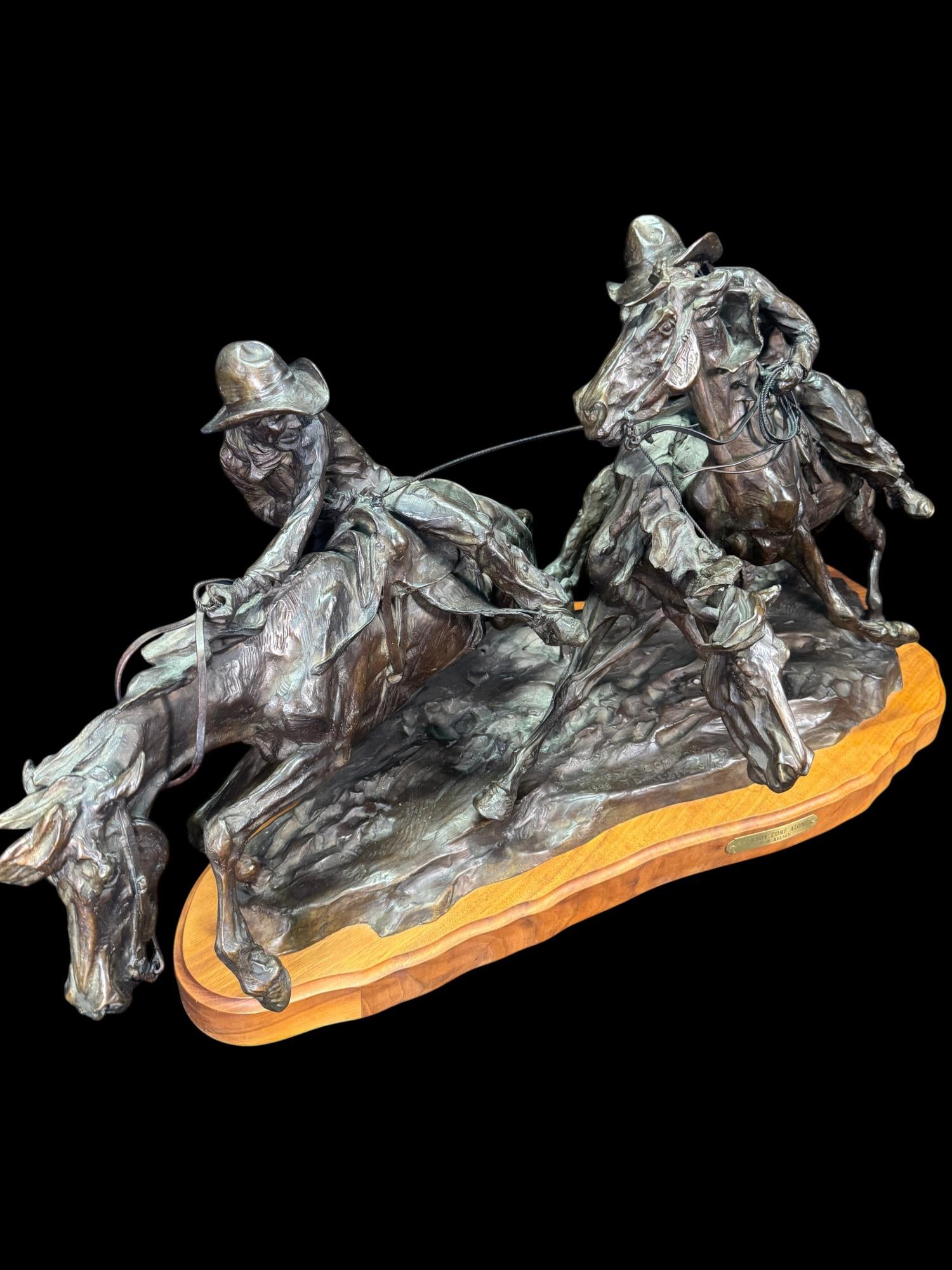 T.D. KELSEY (AMERICAN, B.1946) TITLE "COWBOY COME ALONG": T.D. KELSEY (AMERICAN, B.1946) TITLE "COWBOY COME ALONG", 1986. PATINATED BRONZE SIGNED AND DATED. EDITON 3/15 MOUNTED ON A SHAPED HARDWOOD PLINTH. LIMITED EDITION OF 15. Height: 19.5 in. by Width: 36