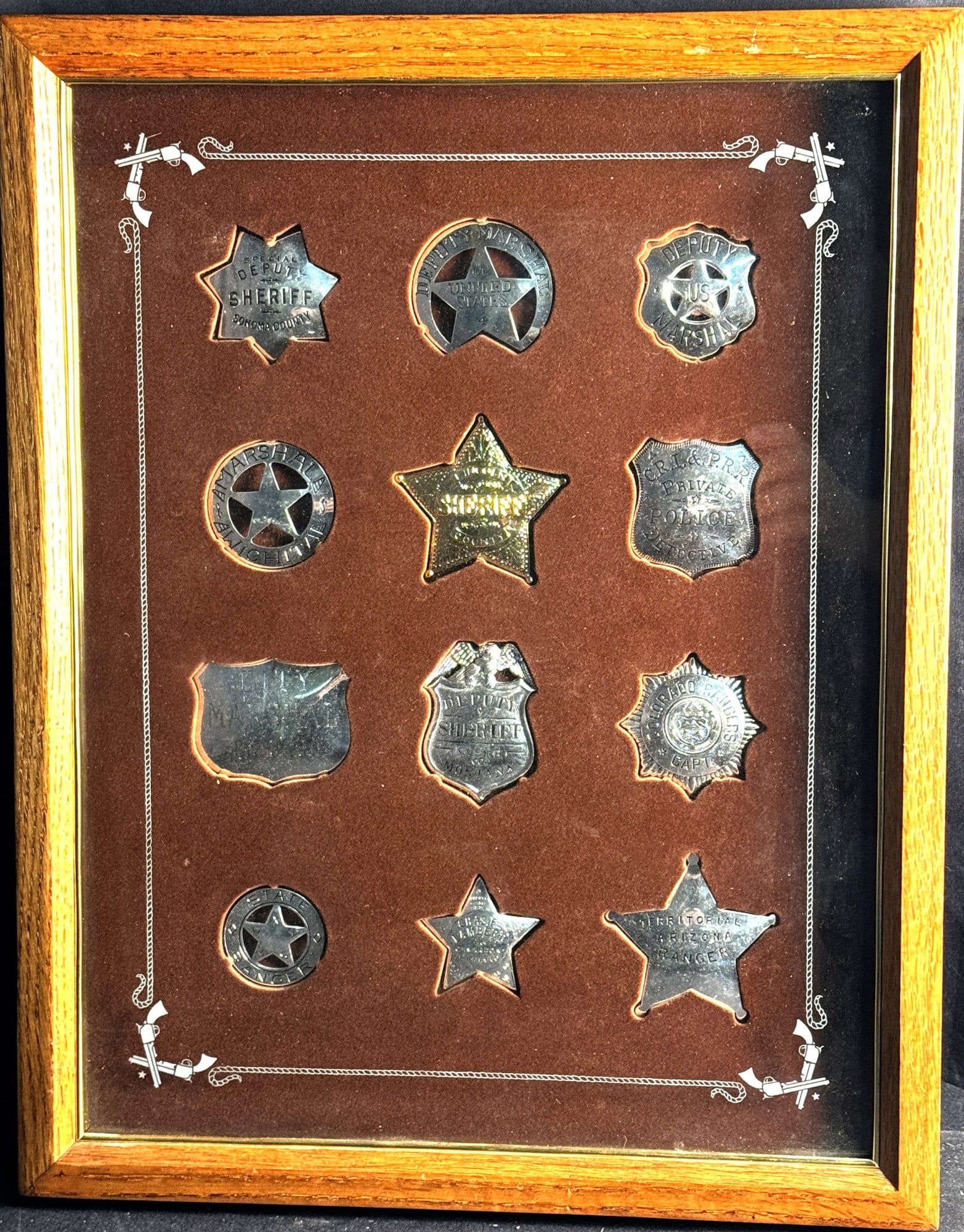 12 FRANKLIN MINT STERLING BADGES IN A DISPLAY CASE (1 of 2)
